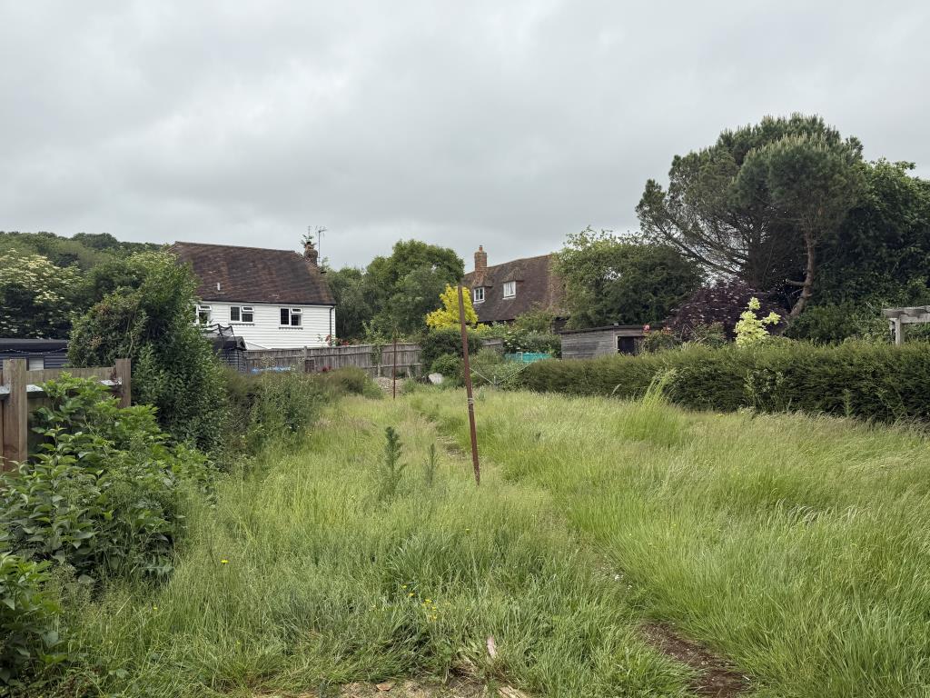 Lot: 135 - SEMI-DETACHED HOUSE IN NEED OF IMPROVEMENT IN VILLAGE SETTING - Rear Garden of Village House in Need of Improvement